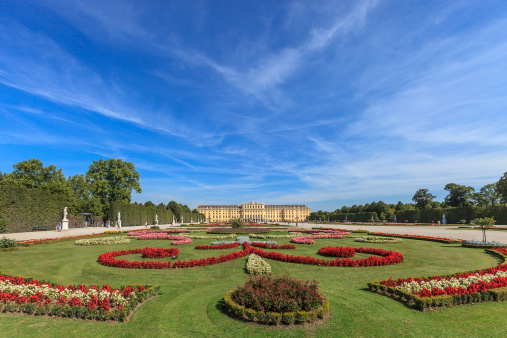 Vienna, Austria - September 10, 2012: Tourists visit the magnificent gardens of Schonbrunn Palace, one of the most significant cultural and naturalistic landmarks not only in Vienna but in whole Austria.