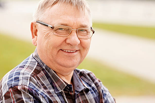 istock Mature man in glasses outdoors 471516764