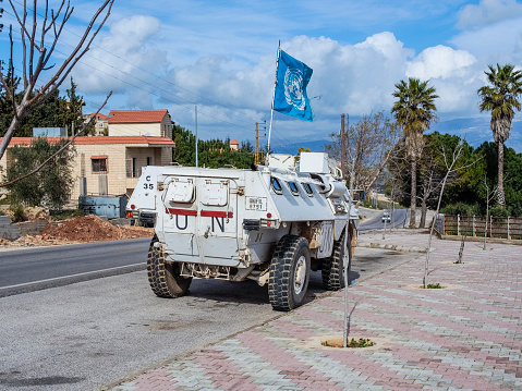 Near Aasaisse, Lebanon – February 28, 2013: A armored personnel carrier of the UNIFIL troops parks on the Lebanese side of the border triangle with Syria and Israel.