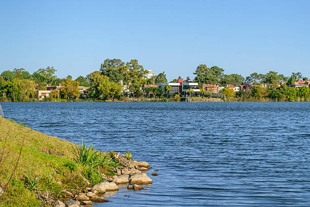 Tranquil and peaceful view of lake and houses in luxury parque miramar neighbourhood located in the oustides of Montevideo in Uruguay, South America.