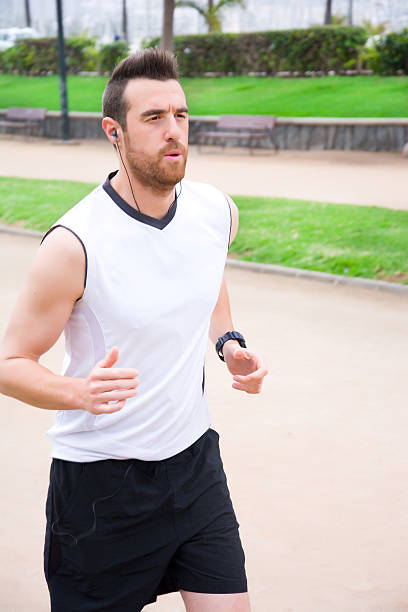 istock man running in the park 471519822