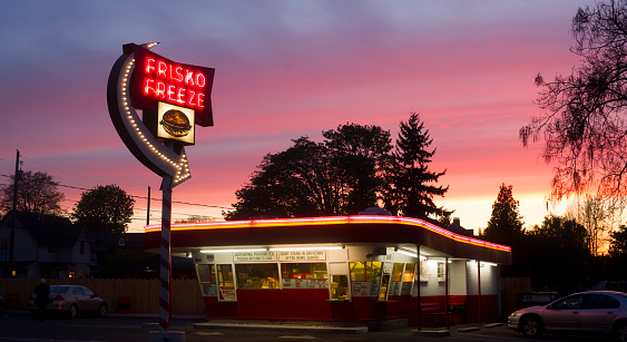 Tacoma, Washington, USA - May 2, 2013: Sun is setting behind the famous Frisko Freeze Hamburger Drive-In on 6th Ave in Tacoma.