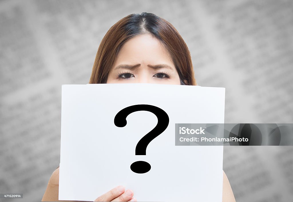 facing problem asian woman holding white paper with question mark with wondering face 2015 Stock Photo