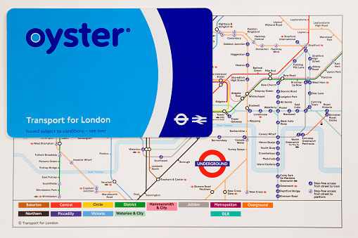 London, United Kingdom, March 12, 2013 : Oyster Card is a plastic smartcard which is used on public transport. Oyster Card is on the map that indicates lines and stations of the London Underground