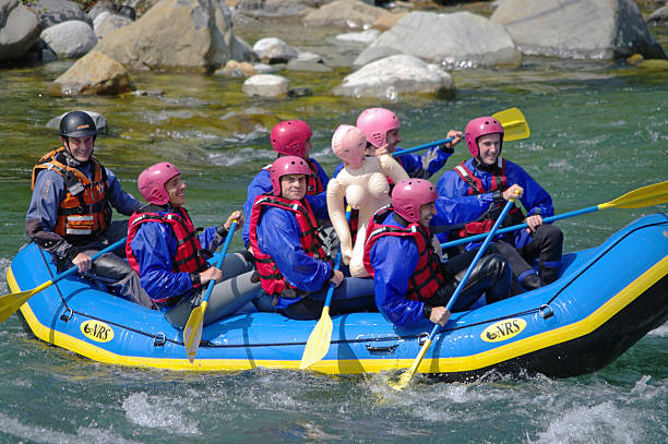 Rafting Varallo Sesia, Italy - June 5, 2010: A group of men and women enjoy a rafting center down the Sesia river in Italy blow up doll stock pictures, royalty-free photos & images