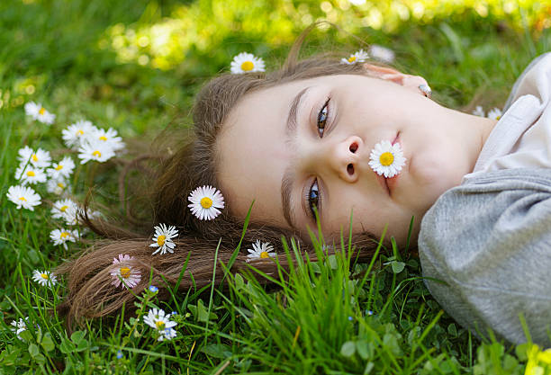 istock Girl  in the grass 471521434