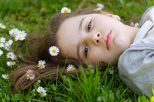 istock Girl  in the grass 471521474