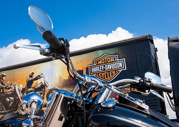 Custom Harley Davidson Motorbike. Antalya, Turkey - May 12, 2013: Harley Davidson is Americas greatest manufacturer of motor cycles. Black custom Harley davidson motorcycle photographed with Harley Davidson Store.Motorbike. 2012 stock pictures, royalty-free photos & images