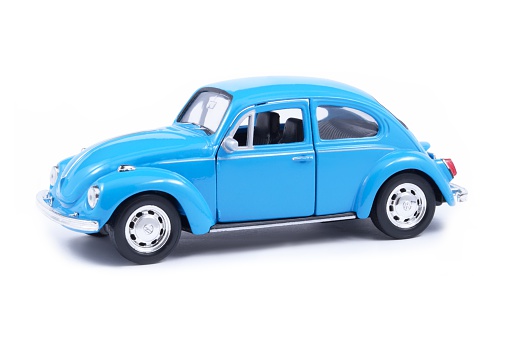 Izmir, Turkey - April 30, 2013: Vintage toy Volkswagen car close up image on isolated white background.
