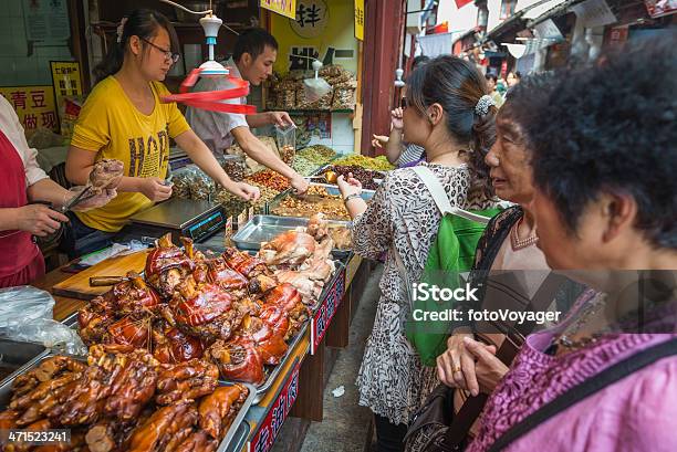 China Women Buying Food At Street Stall Market Shanghai Stock Photo - Download Image Now
