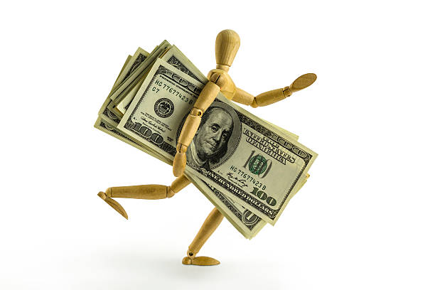 Artist's Figure running with a lot of money stock photo