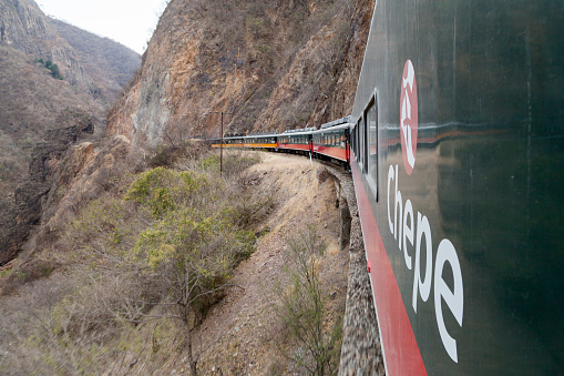 Cerocahui, Mexico - May 7, 2012: Tourist taking pictures along from the train in the Copper canyon in Mexico. Copper Canyon is a group of canyons consisting of six distinct canyons in the Sierra Tarahumara (Sierra Madre) in the southwestern part of the state of Chihuahua in Mexico.