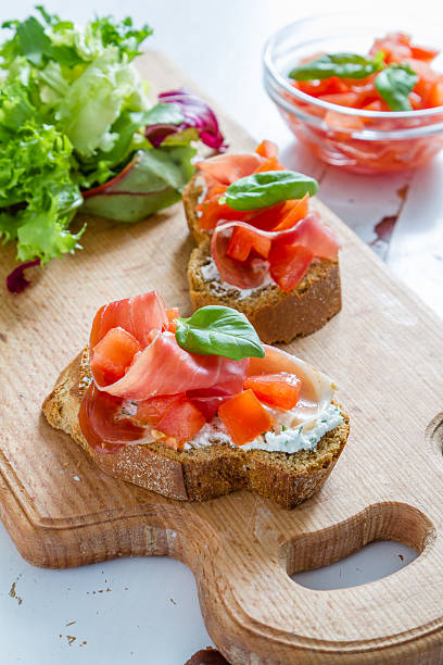 istock Tomato bruschetta with basil leafs, garlic, meat, cottage cheese 471524558