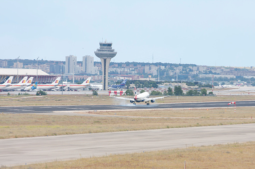 Madrid, Spain - May 18th, 2013: An IBERIA Company's plane landing in Barajas Airport, Madrid, Spain.
