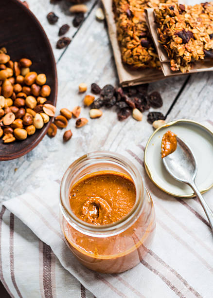 istock Fresh peanut butter in the pot and tea spoon 471526016