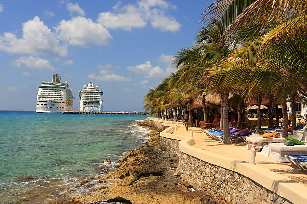 Caribbean: Cozumel, Mexico Cozumel, Mexico - April 16, 2013: Cruise Ships Mariner of the Seas and Jewel of the Seas docked at Cozumel, Mexico, which is off the eastern coast of Mexico's Yucatán Peninsula, and is an island in the Caribbean Sea; visitors can be seen everywhere san miguel de cozumel stock pictures, royalty-free photos & images