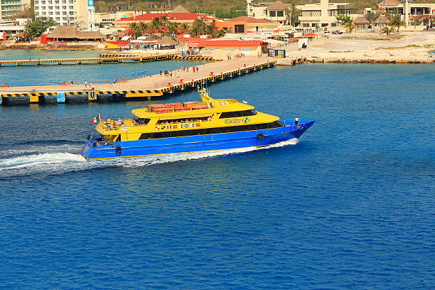 Caribbean: Cozumel, Mexico Cozumel, Mexico - April 16, 2013: Tourist boat UltraMar docked at Cozumel, Mexico, which is off the eastern coast of Mexico's Yucatán Peninsula, and is an island in the Caribbean Sea; visitors can be seen everywhere san miguel de cozumel stock pictures, royalty-free photos & images