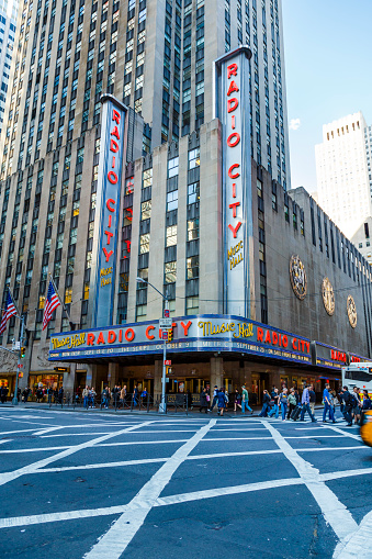 New York City, USA - May 11, 2012: An Art deco Radio City Music Hall is an entertainment venue part of Rockefeller Center, located at 1260 6th Avenue (Avenue of the Americas), on corner of the Sixth Avenue and W 50th Street in New York City, Manhattan, USA. It was opened on December 27, 1932 and it is one of top tourist attraction in New York City.