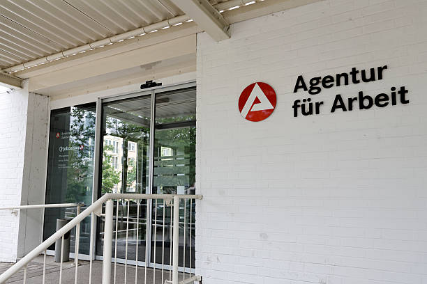 Employment Agency - employment center Fuerth, Germany - May 20, 2013: The entrance area of Agentur fuer Arbeit / employment center with sign and name of the office on white brick wall. The Agentur fuer Arbeit  / employment center is for people who looking for a new job if they are unemployed. fuerth stock pictures, royalty-free photos & images
