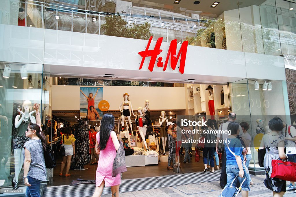 H&M Hong Kong Hong Kong, China - May 18, 2013: Chinese walk past the H&M Shop in Canton Road, Tsim Sha Tsui, Hong Kong at Day.  Asia Stock Photo