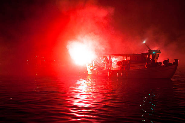 Peloponnese, Greece - May 6, 2013: The ritual burning of Judas Iscariot at sea during the Orthodox Easter.