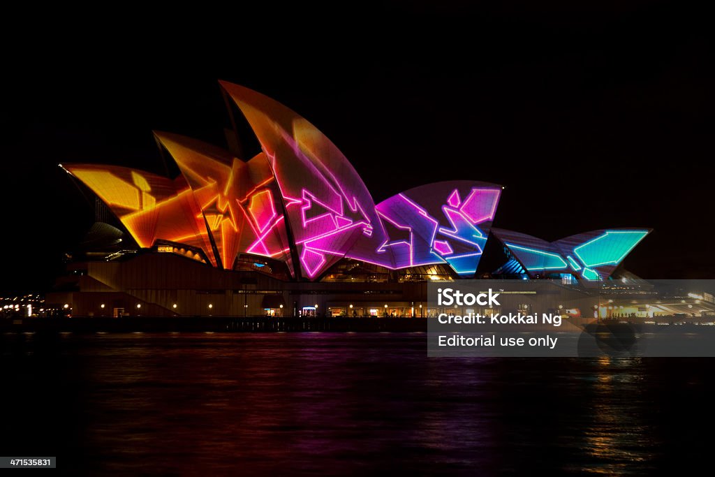 Vivid Sydney - Opera House Sydney, Australia - May 24, 2013: The Sydney Opera House has a colourful design projected onto its sails at night as part of the Vivid Sydney festival. Dark Stock Photo