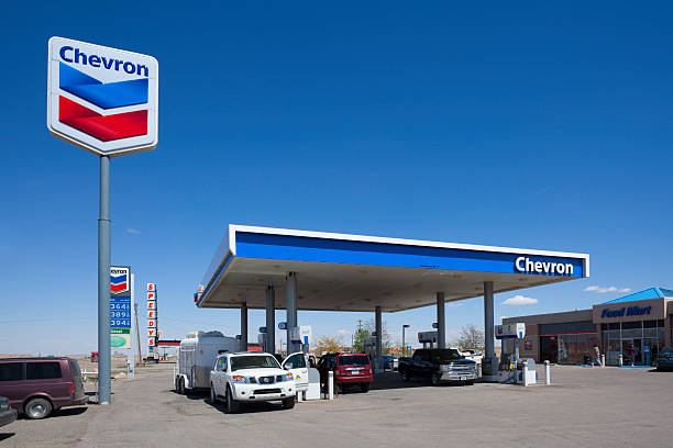 Chevron gas station Kayenta, Arizona, USA - May 12, 2013: People parking at the Chevron gas station to fill up on gas before continuing on their journey. Chevron  is an american multinational energy corporation operating in more than 180 countries. kayenta photos stock pictures, royalty-free photos & images