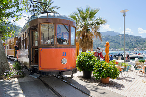 Soller, Majorca, Spain -April 21st, 2013; The tram system that connecting the village of Soller to Puerto de Soller on the island of Majorca was formely part of the cable car system of San Francisco. Because of the proxinity to street cafes and side walks drivers have to exercise extra special care.