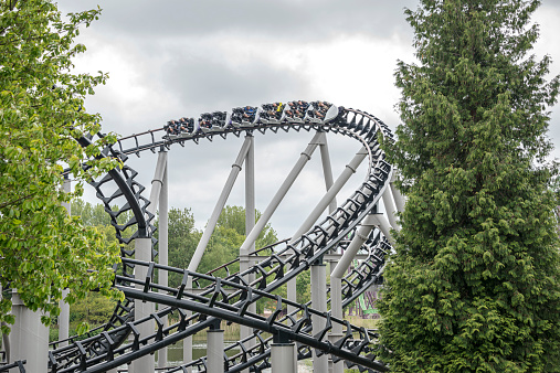Biddinghuizen, Holland - May 25, 2013: people having fun in the rollarcoaster on May 25,2013 in Biddinghuizen, Holland. This amusement park  Walibi is the biggest rollarcoasterpark in Holland
