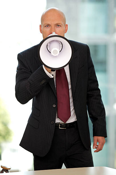 istock Young confident caucasian businessman screaming at camera 471539778