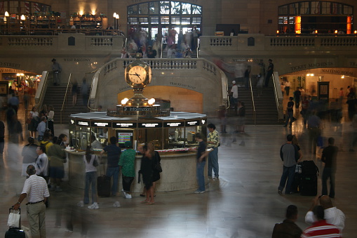 New York, New York, USA - June 10, 2007: Passengers buying tickets under the clock at Grand Central Station in Midtown Manhattan.