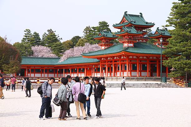 Kyoto, Japan - April 19, 2012: People visit Heian Jingu shrine on April 19, 2012 in Kyoto, Japan. Old Kyoto is a UNESCO World Heritage site and was visited by almost 1 million foreign tourists in 2010.