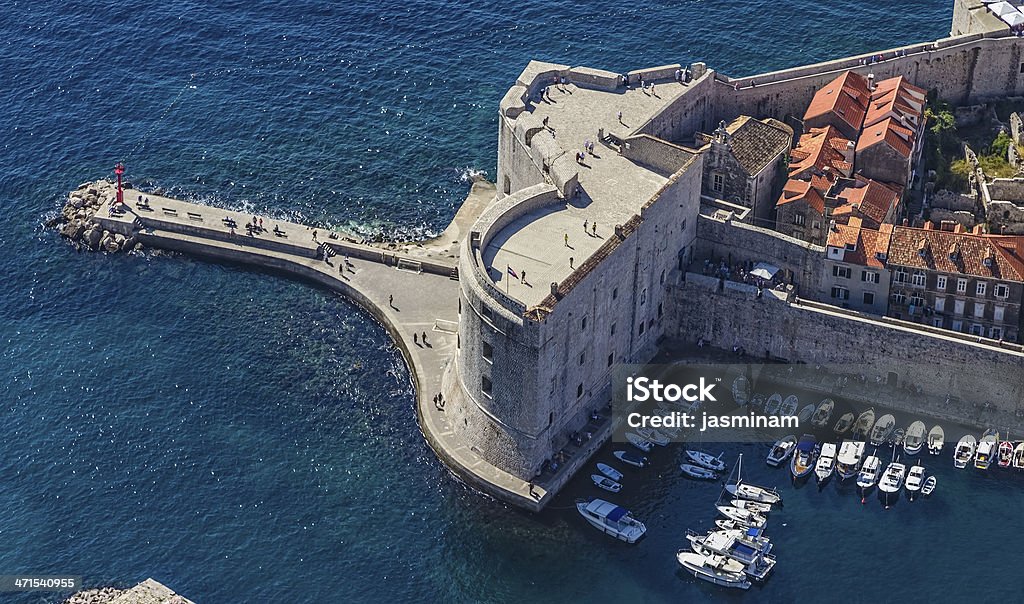 Dubrovnik old town Aerial helicopter shoot of Dubrovnik old town harbor and st. John fortress. Adriatic Sea Stock Photo