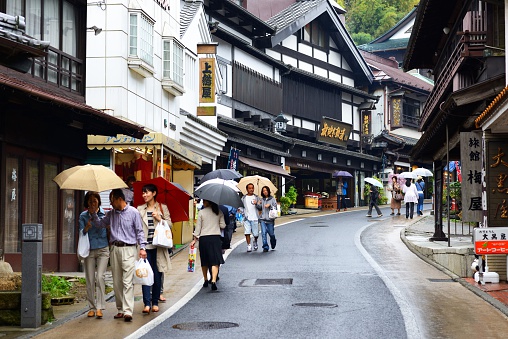 Narita, Japan - October 6, 2012: Shoppers pass through Omote-sando traditional street. The historic town is a popular destination located near Narita International Airport.