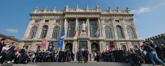 Turin, Italy - April, 16th 2011: Two officers of the Italian army do the honors at the war memorial during the national meeting of the Grenadiers of Sardinia for 150th anniversary of the unity of Italy celebrated in Turin.