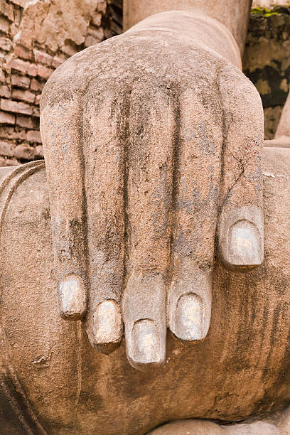 istock Hand of Buddha statue vertical 471542539