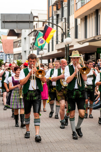 Blumenau, Santa Catarina, Brasil - October 15, 2011: Members of a traditional german band, from Munich, performing during the street parade in XV November Street (Rua Quinze de Novembro) in Blumenau to celebrate the Oktoberfest. Each year the city of Blumenau in Santa Catarina State invites many bands from Germany to take part in the brazilian Oktoberfest.