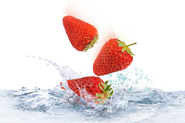 istock Strawberry jumping into water 471544234