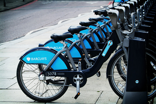 London, United Kingdom - 6th May 2013: A row of the so called Boris's bikes in central London. The bikes and the docking stations are part of Barclay's Cycle Hire Scheme functioning in London and introduced under the mayorship of Boris Johnson.