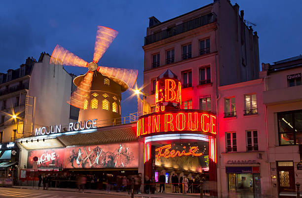 Moulin Rouge Paris, France - February 21, 2013: Le Moulin Rouge (Red Mill) is a cabaret built in 1889. It's situated near Montmartre in the district of Pigalle in the 18th arrondissement of Paris. place pigalle stock pictures, royalty-free photos & images