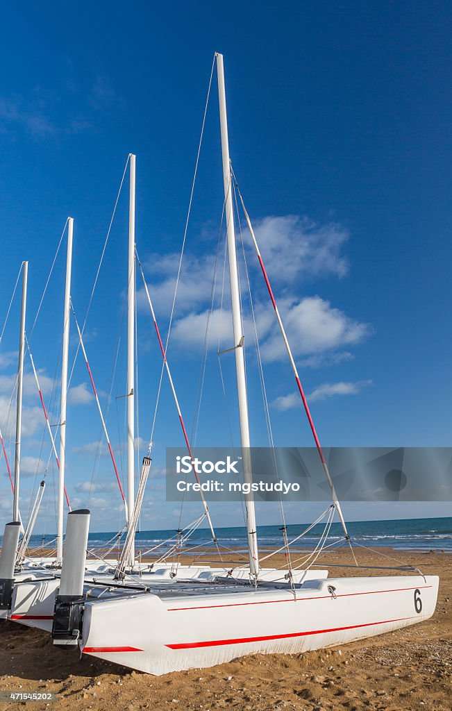 catamaran Sail boats catamaran on sandy beach 2015 Stock Photo