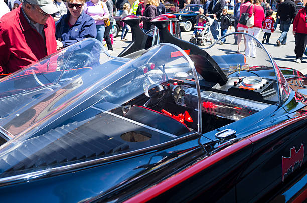 Chatham, Canada - May 23, 2013: Classic Car On Display At The 11th Annual Retrofest. This car is the 1966 Batmobile. Onlookers are enjoying the vehicles and taking photos of each other with the car.
