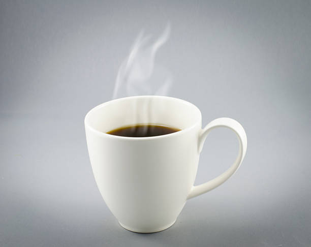 istock Cup of hot coffee with steam on gray background 471545818