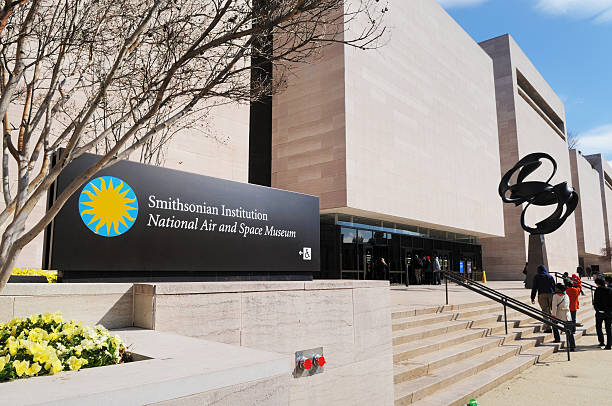 Smithsonian Institution National Air and Space Museum Entrance Washington, D.C., USA - March 27, 2013: People entering the Smithsonian Institution National Air and Space Museum entrance in Washington, D.C. smithsonian museums stock pictures, royalty-free photos & images