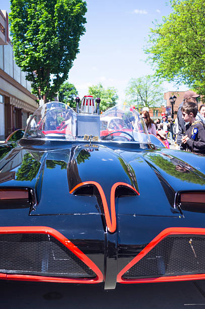 Chatham, Canada - May 23, 2013: Classic Car On Display At The 11th Annual Retrofest. This car is the 1966 Batmobile. Onlookers are enjoying the vehicles and taking photos of each other with the car.