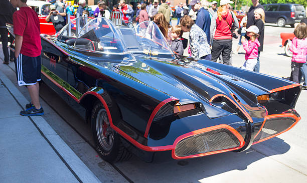 Chatham, Canada - May 23, 2013: Classic Car On Display At The 11th Annual Retrofest. This car is the 1966 Batmobile. Onlookers are enjoying the vehicles and taking photos of each other with the car.