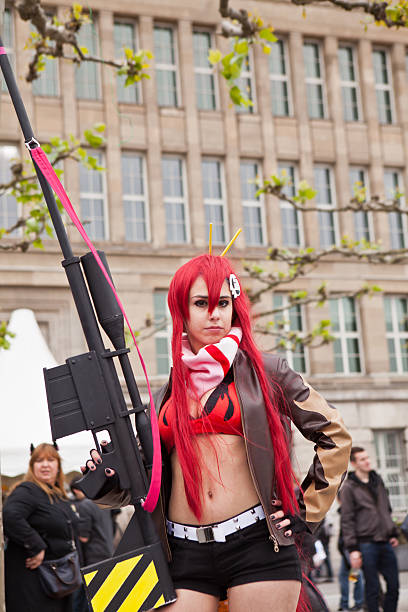 cos-play model posing Düsseldorf, Germany - May 25, 2013: cos-play model posing on Rhine river promenade in Düsseldorf during Japan Day festivities - people in a thback watching and passing by model rocket stock pictures, royalty-free photos & images