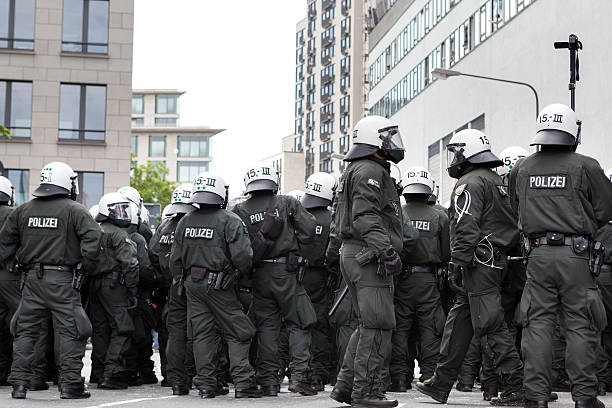 Blockupy 2013, Frankfurt Frankfurt, Germany - June 1, 2013: A riot police cordon at Blockupy 2013 demonstration in the city center of Frankfurt during the kettling of app. 400 protestors. protestors at blockupy 2013 demonstration frankfurt stock pictures, royalty-free photos & images