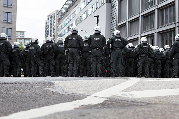Blockupy 2013, Frankfurt Frankfurt, Germany - June 1, 2013: A riot police cordon at Blockupy 2013 demonstration in the city center of Frankfurt during the kettling of app. 400 protestors. protestors at blockupy 2013 demonstration frankfurt stock pictures, royalty-free photos & images