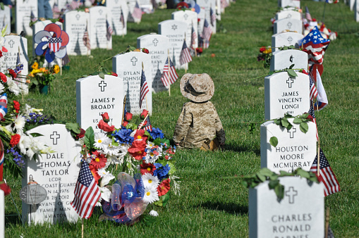 Arlington, Va. USA - May 27, 2013: A young boy dressed in camouflage visits Arlington National Cemetery on Memorial Day.  